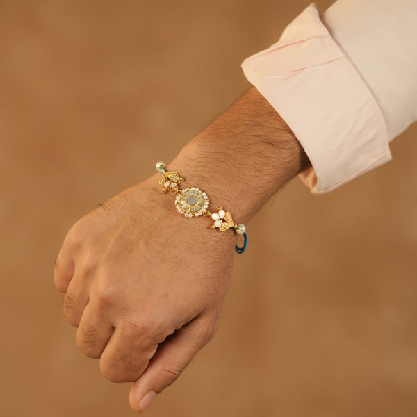 MDRB1278 - White Colour Gold Plated Mother of Pearl Thread Rakhi