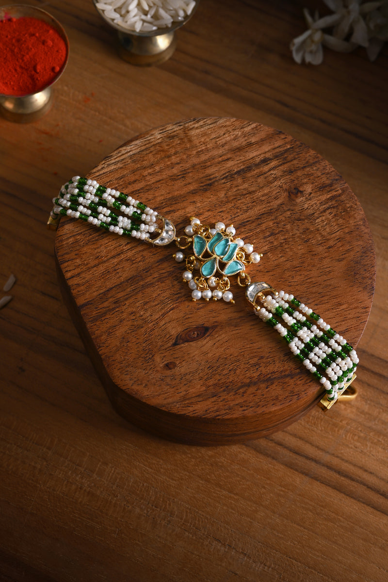 Blue and White Colour Gold Plated Jadau Kundan Lotus Motif Rakhi