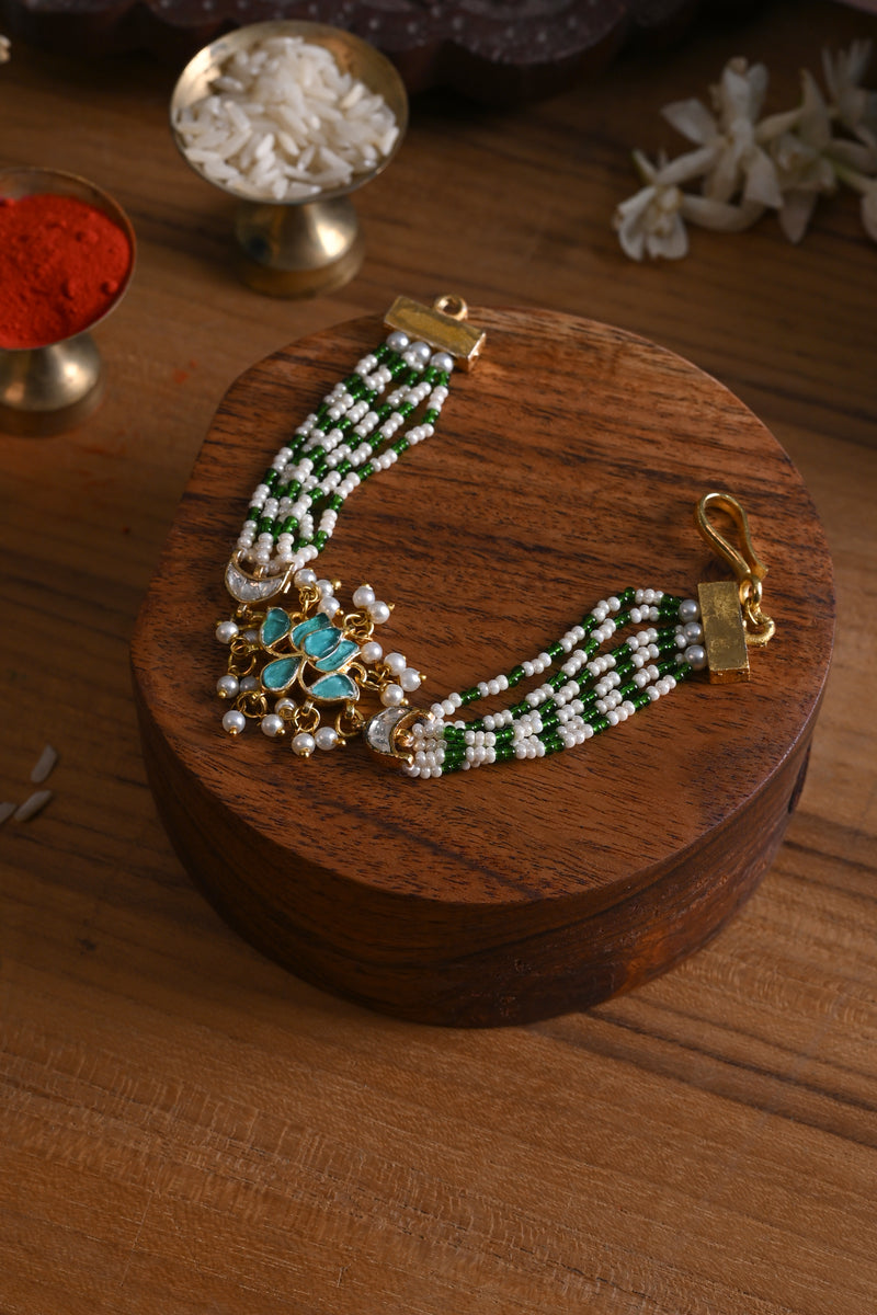 Blue and White Colour Gold Plated Jadau Kundan Lotus Motif Rakhi