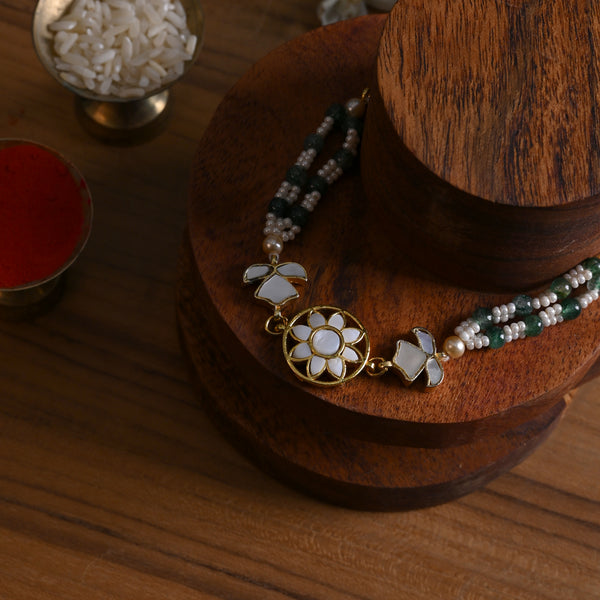 MDB842- White and Green Colour Gold Plated Mother of Pearl Rakhi