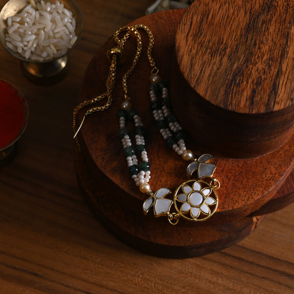 MDB842- White and Green Colour Gold Plated Mother of Pearl Rakhi