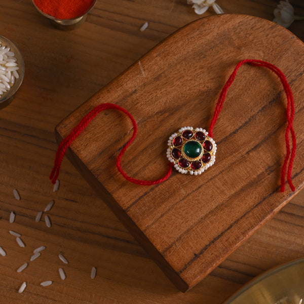 MDB844- Red and Green Colour Gold Plated Jadau Kundan Flower Motif Rakhi