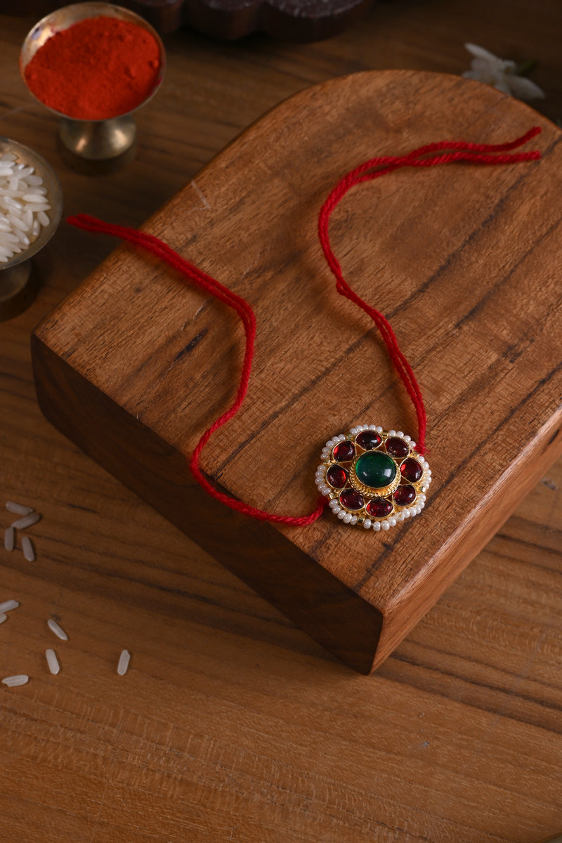 Red and Green Colour Gold Plated Jadau Kundan Flower Motif Rakhi