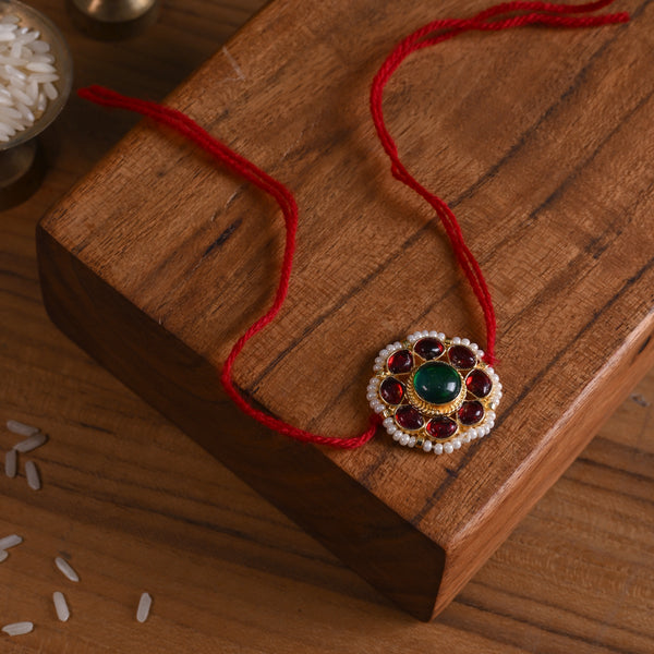 MDB844- Red and Green Colour Gold Plated Jadau Kundan Flower Motif Rakhi