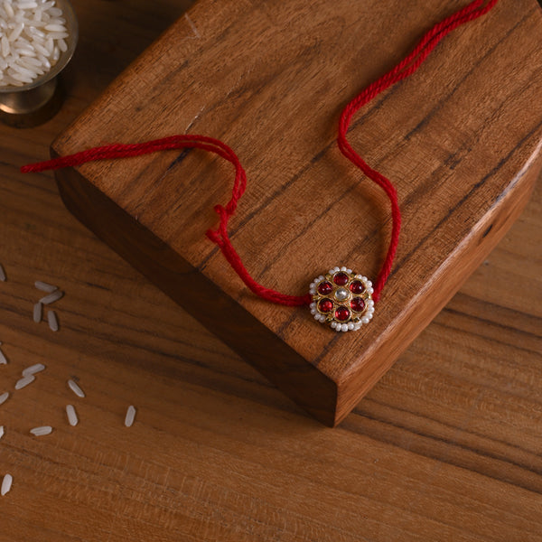 MDB845- Red and White Colour Gold Plated Jadau Kundan Flower Motif Rakhi