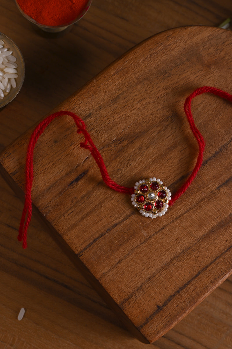 Red and White Colour Gold Plated Jadau Kundan Flower Motif Rakhi